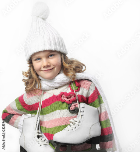 girl in winter clothes with figure skates