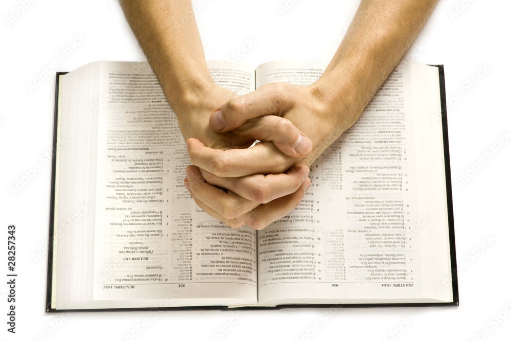 Fototapeta premium Hands on bible
