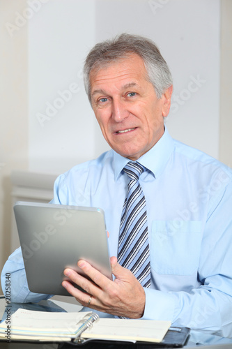 Portrait of senior businessman in office