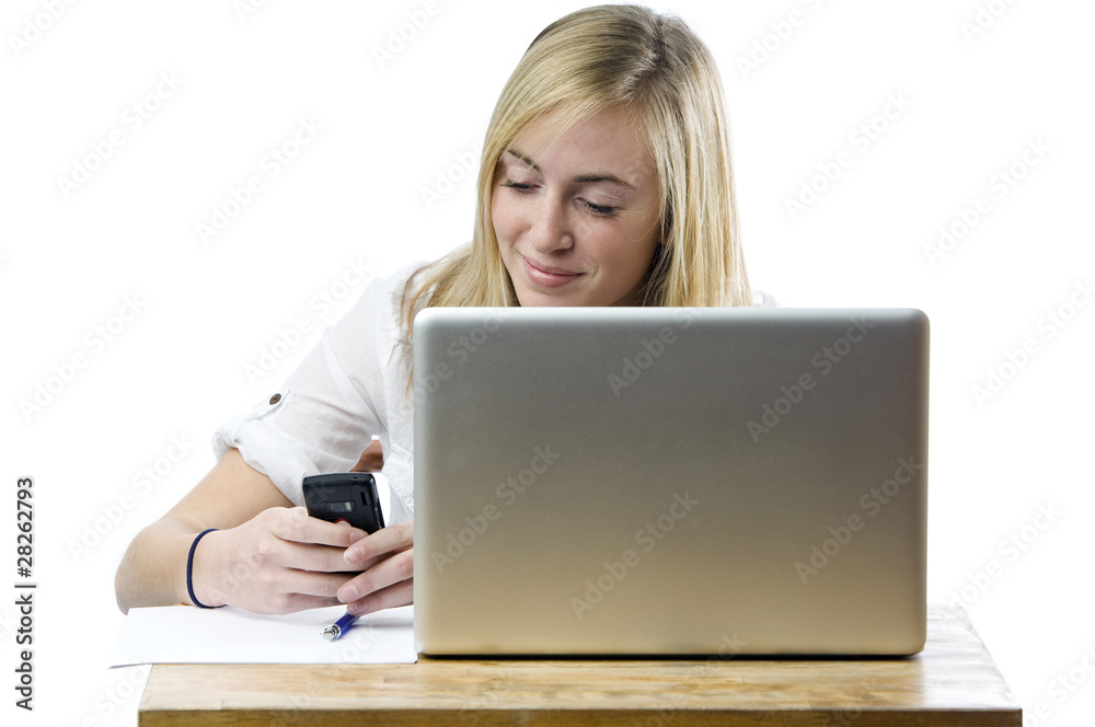 Teenage girl with laptop computer and mobile phone