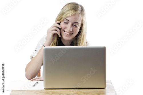 Teenage girl with laptop computer and mobile phone