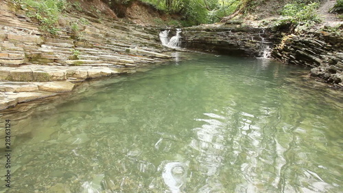 Waterfalls at a wood river