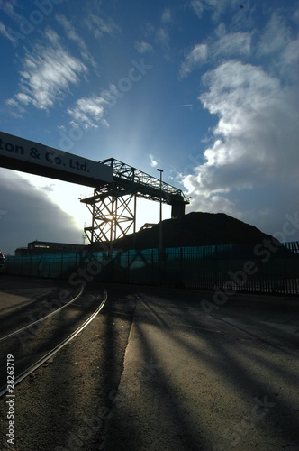 Industrial conveyor belt loading mid afternoon