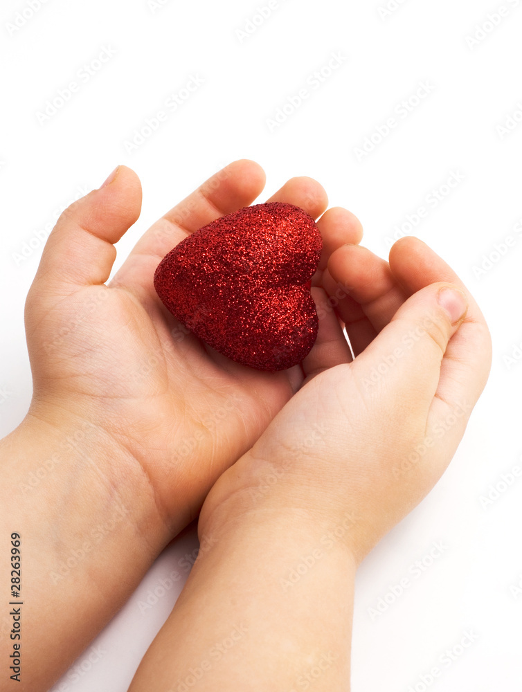 Obraz premium red heart in the children's arm