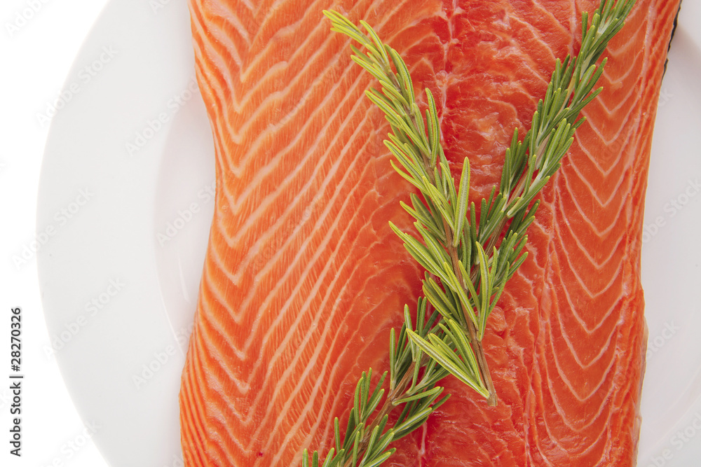 raw salmon fillet on white and rosemary raw salmon fillet on white and rosemary