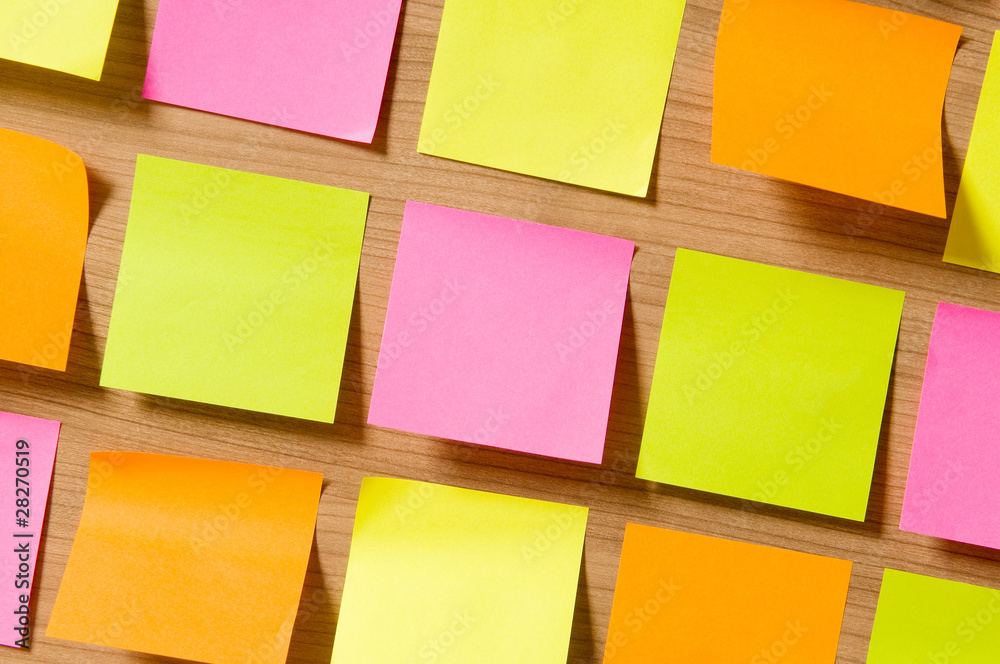 Fototapeta premium Many reminder notes on the wooden background