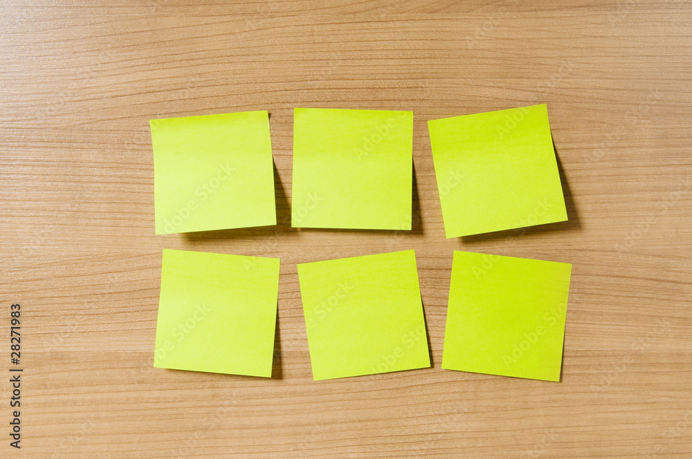 Fototapeta premium Many reminder notes on the wooden background