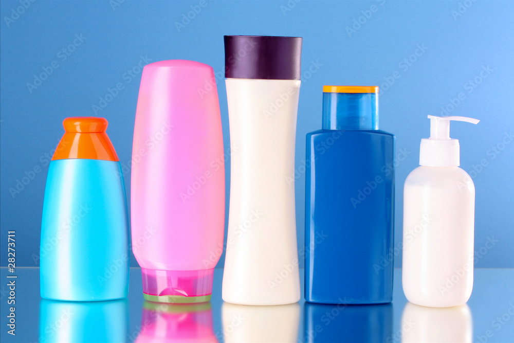 bottles of health and beauty products on blue background bottles of health and beauty products on blue background