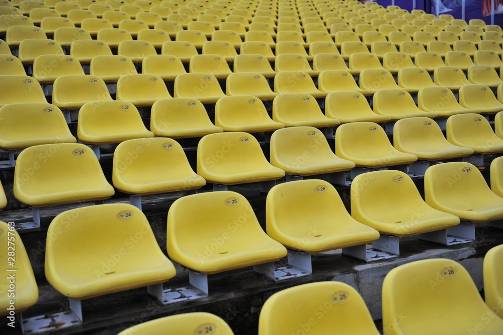 Fototapeta premium yellow plastic chair in the stadium
