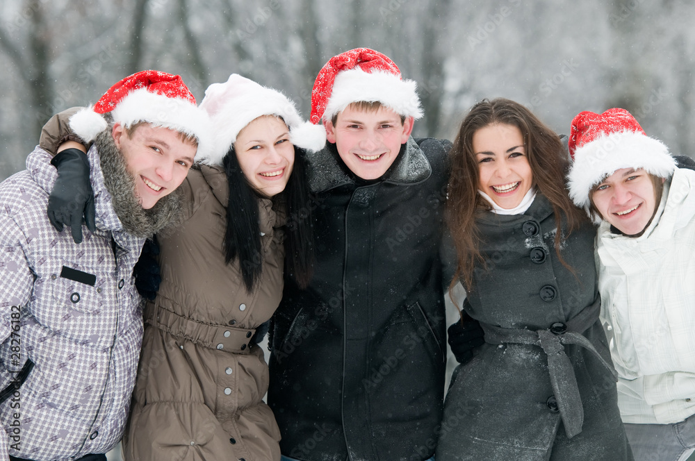 group of smiling young people in winter group of smiling young people in winter
