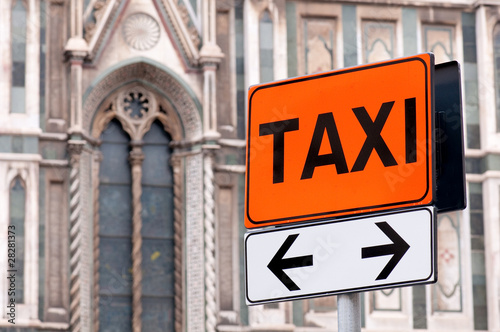 Taxi rank sign with Italian church in background © avorym