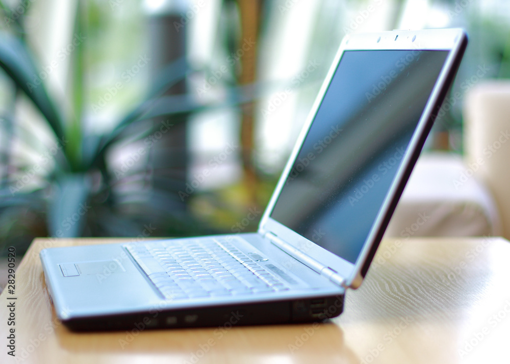 thin laptop on office desk thin laptop on office desk