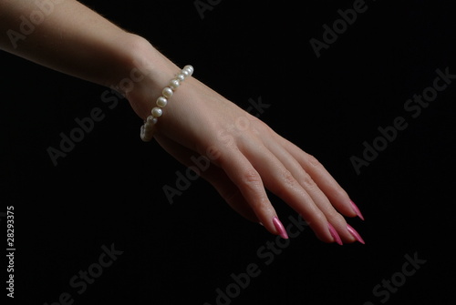 Hand with a pearl bracelet