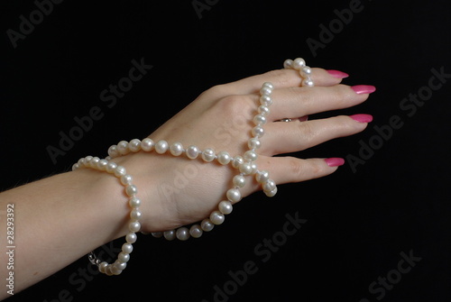 Female hand with pearl beads