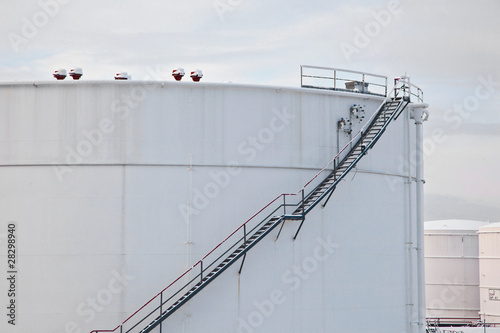 white tanks in tank farm with snow in winter