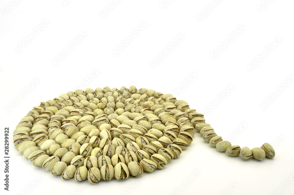 pistachio nuts arranged in a spiral isolated on white pistachio nuts arranged in a spiral isolated on white