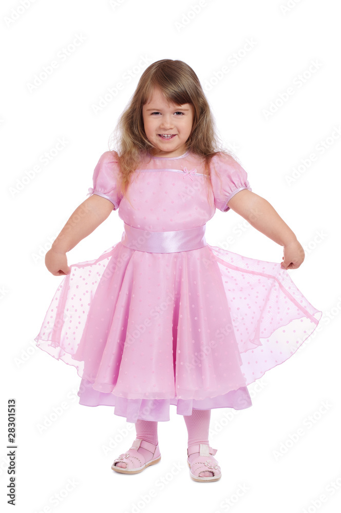 Little smiling girl in pink dress