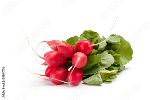 radish with green leaves on a white background
