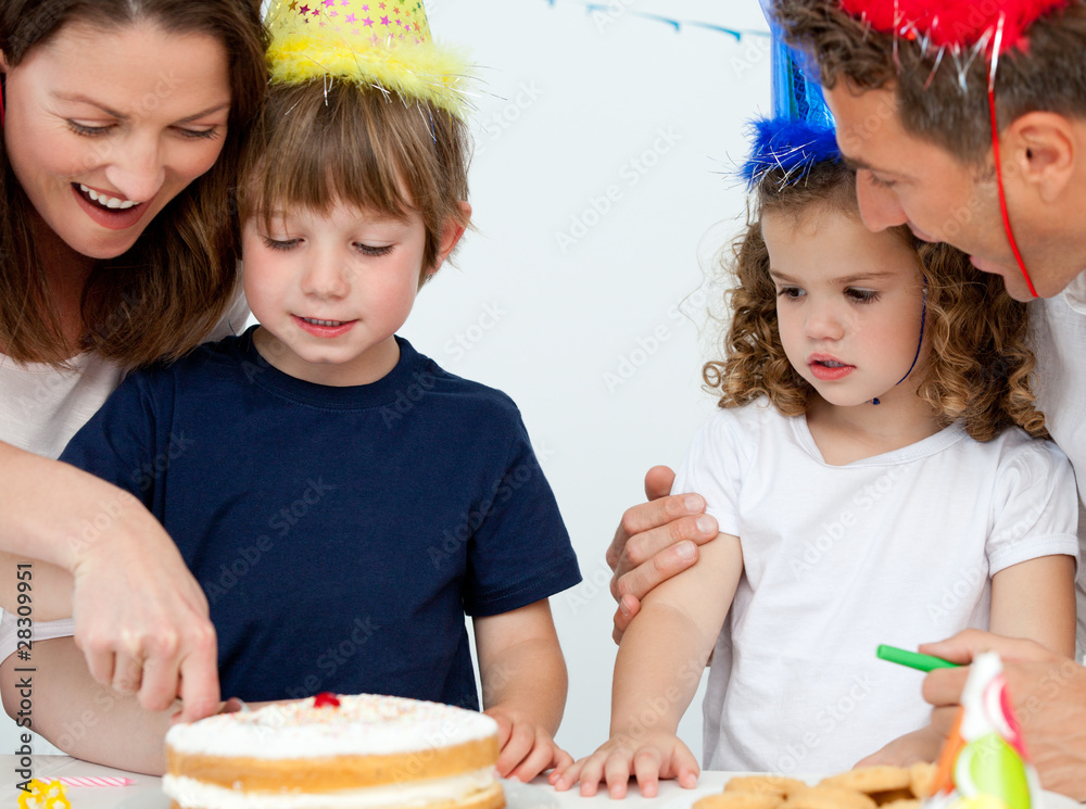 Happy Young-Female Cutting Birthday -Cake With Friends Celebrating Birthday  party At-Home