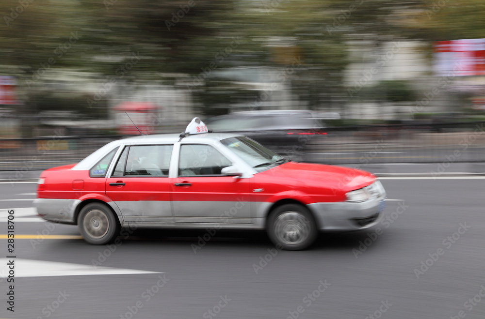 Naklejka premium Taxi in the street of Shanghai, China. With motion blur