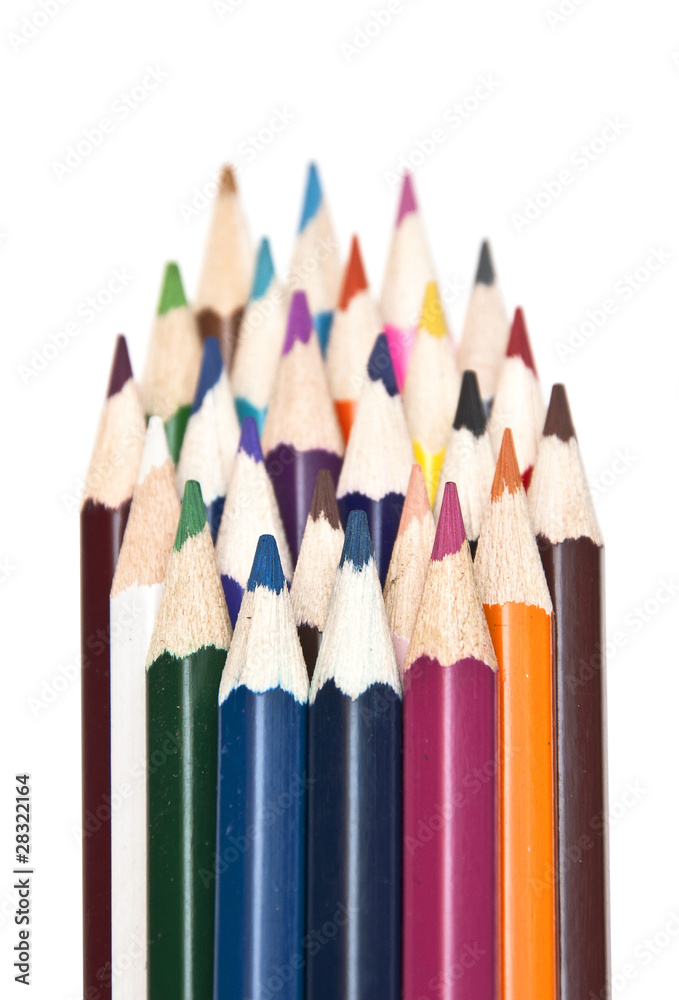 closeup stack of colored pencils isolated on white background closeup stack of colored pencils isolated on white background