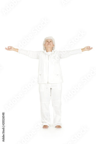elderly woman practicing yoga