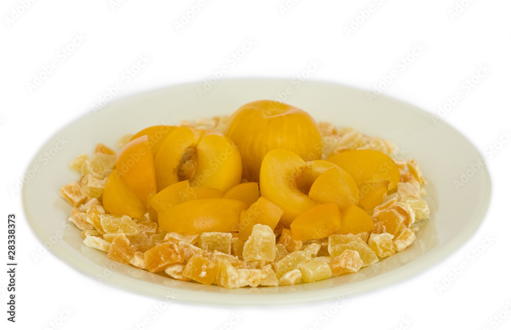 Fresh and dried fruit on a plate, isolated on whtie background.