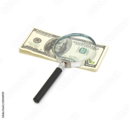 Magnifying glass on money