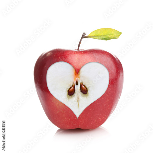 Perfect fresh red apple with a heart shaped cut-out on white photo