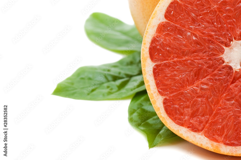 Fresh juicy grapefruits with green leafs. Isolated Fresh juicy grapefruits with green leafs. Isolated