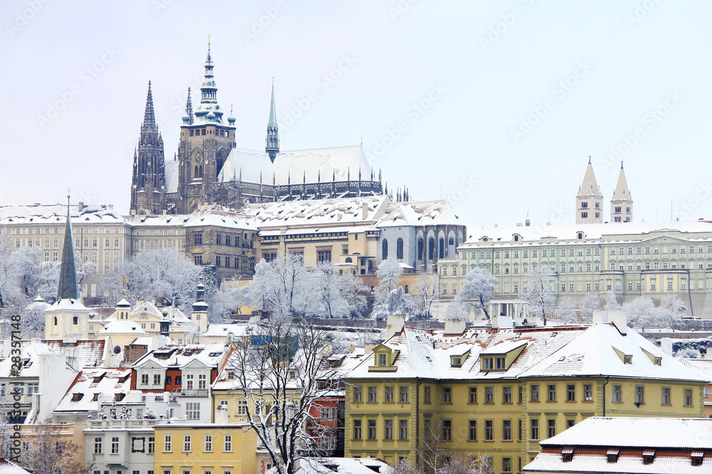 Fototapeta premium First Snow in Prague, gothic Castle above the River Vltava