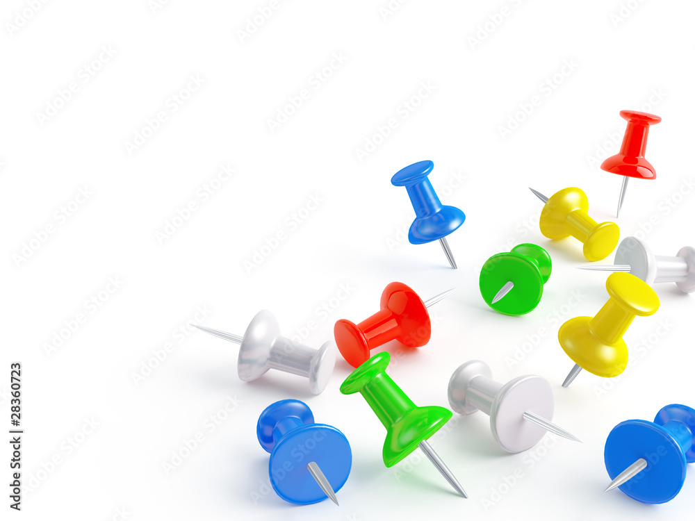 attached varicolored office pins on white background attached varicolored office pins on white background