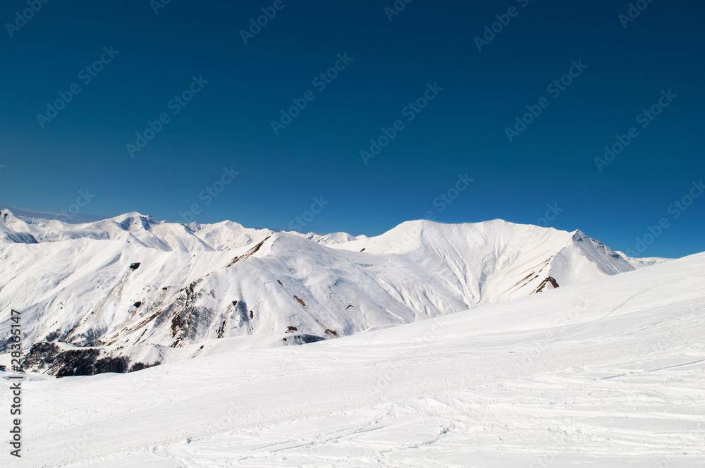 High mountains under snow in the winter High mountains under snow in the winter