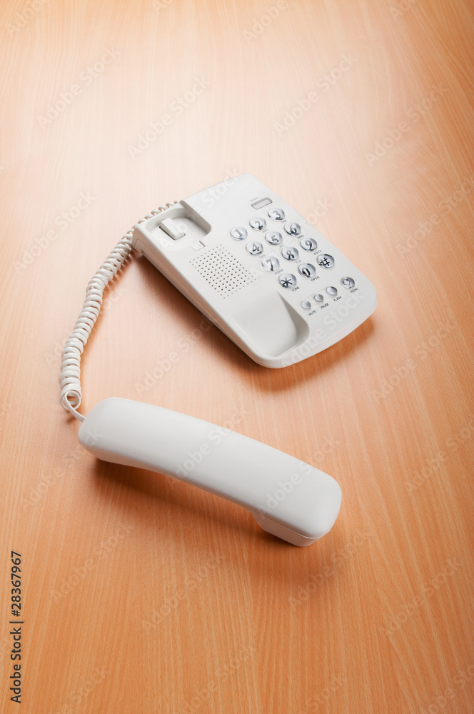 White office phone on the flat surface White office phone on the flat surface