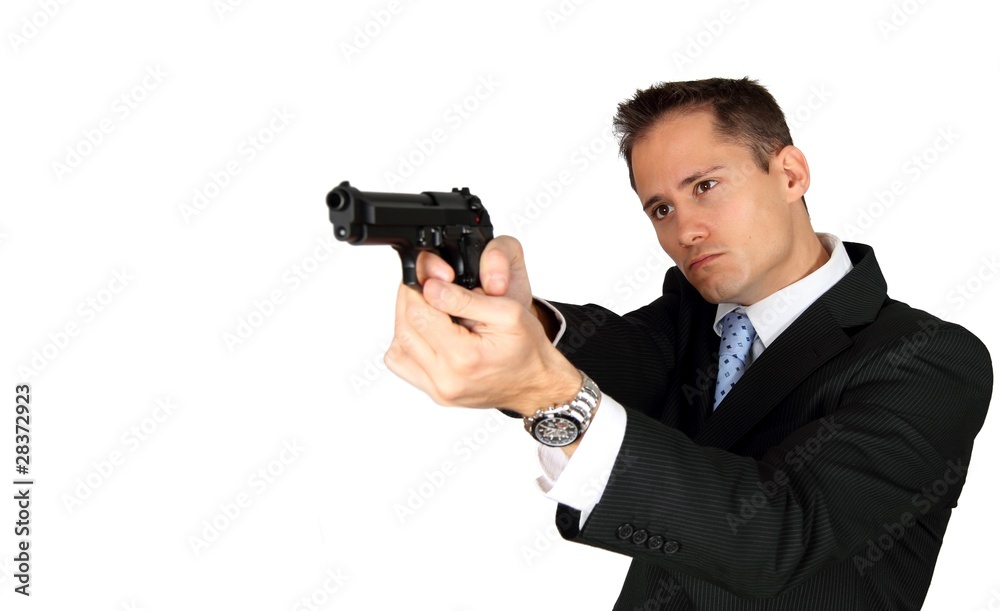 A Secret Agent taking aim with his pistol A Secret Agent taking aim with his pistol