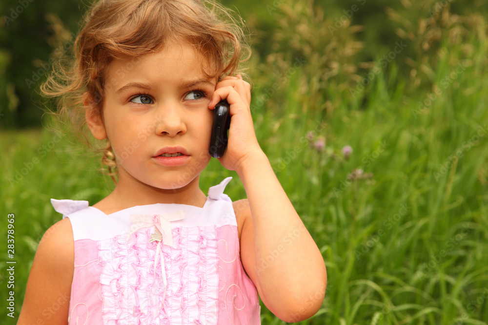 beautiful little girl in dress talking on cell phone outdoor beautiful little girl in dress talking on cell phone outdoor