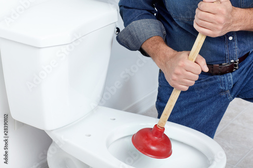 Photos Plumber with a plunger