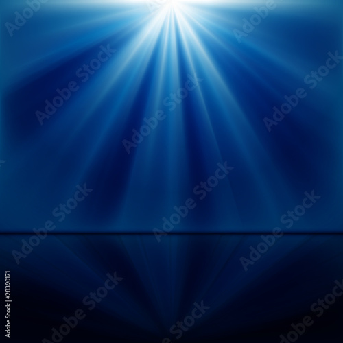 background of blue luminous rays with reflection