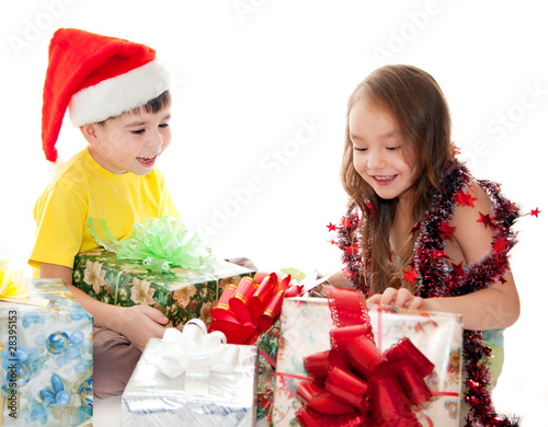 Boy and girl are holding a gift isolation on white photo