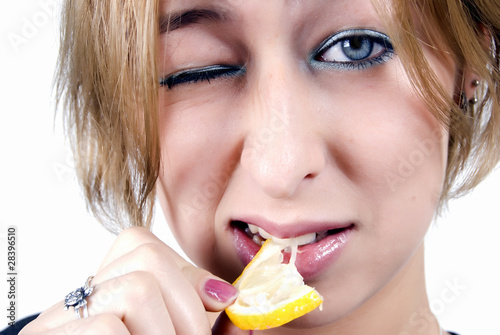 girl eating a lemon
