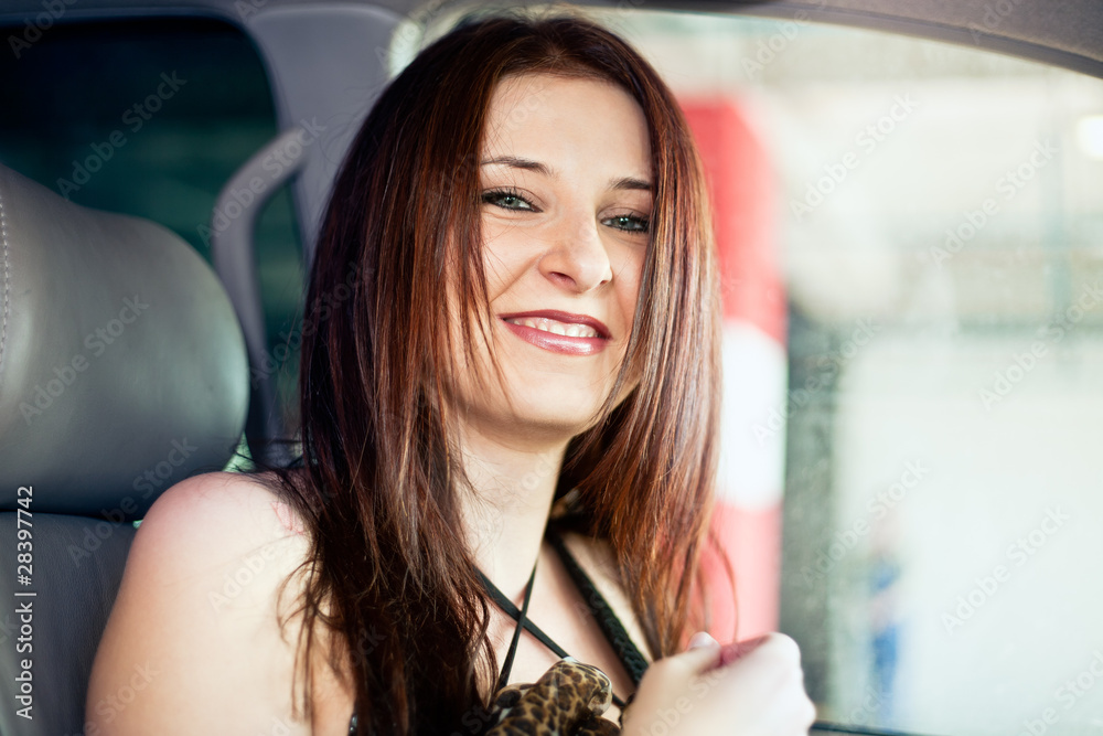 Beautiful brunette woman in car Stock Photo | Adobe Stock