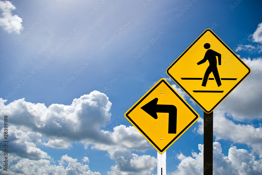 Turn left sign and a man walking sign Turn left sign and a man walking sign