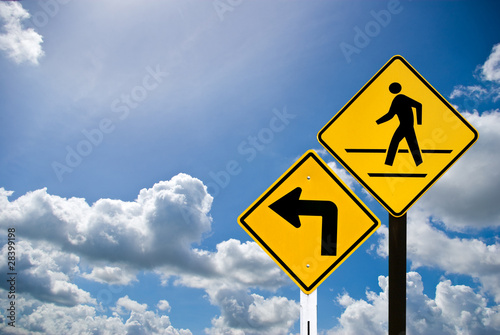 Turn left sign and a man walking sign