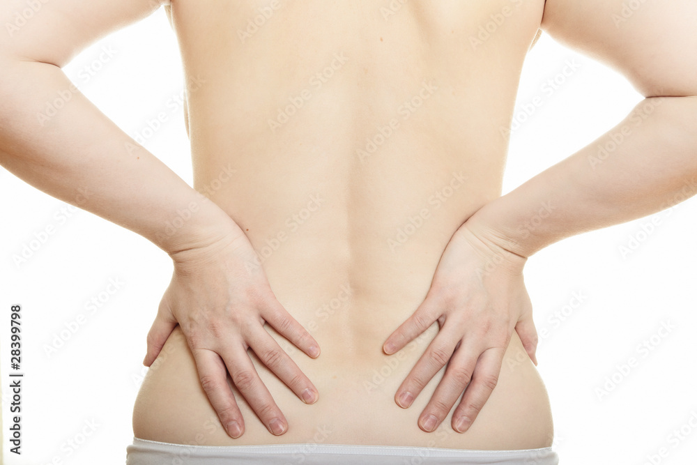 Woman massaging pain back isolated over a white background Woman massaging pain back isolated over a white background