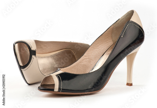 Two female open-toe shoes over white background