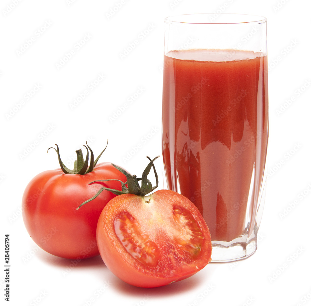 Fresh tomatoes and a glass full of tomato juice Fresh tomatoes and a glass full of tomato juice
