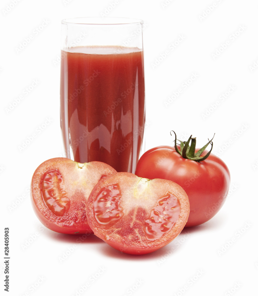 Fresh tomatoes and a glass full of tomato juice