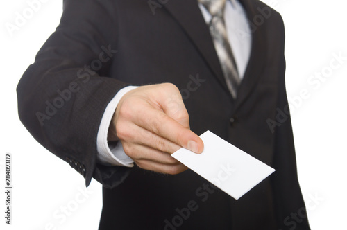 Businessman handing a blank business card over white