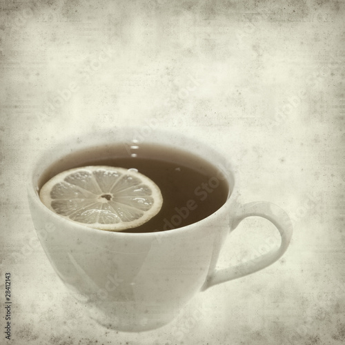 textured old paper background withcup of tea