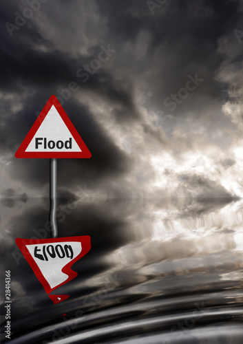 Realistic metallic, reflective flood warning sign against stormy